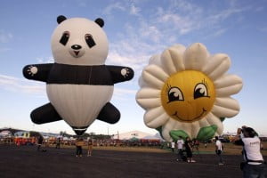 a panda-shaped and sunflower-shaped balloons
