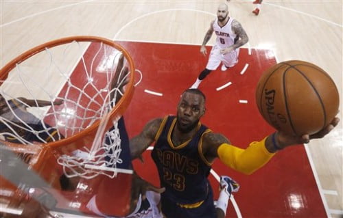 Cleveland Cavaliers forward LeBron James (23) shoots against the Atlanta Hawks during the first half in Game 1 of the Eastern Conference finals of the NBA basketball playoffs, Wednesday, May 20, 2015, in Atlanta. (AP Photo/John Bazemore)