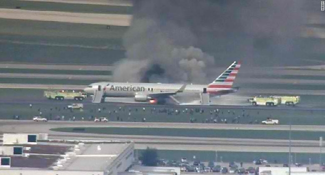 LOOK: American Airlines Catches Fire On Runway (Watch Video)