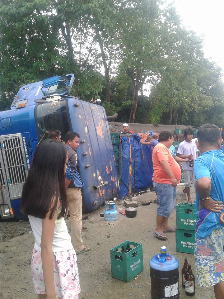 Group Of Men Take Advantage, Transferring Beers To Containers During