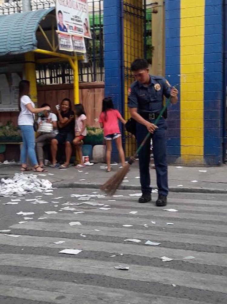 Policeman Who Cleans The Street From Scattered Brgy. Elections ...