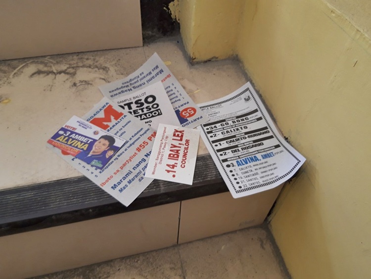 Campaign Materials w/ Politicians' Names Seen Outside Voting Precincts