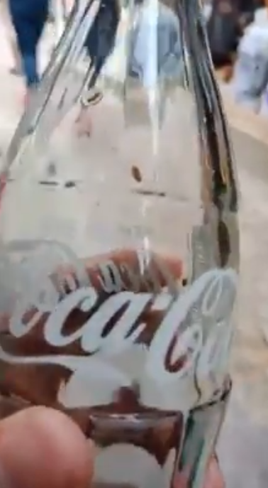 Maggots inside Coca-Cola Bottle