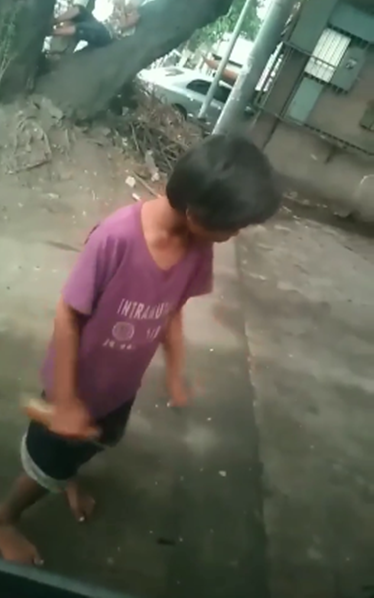 Young Street Kid Caught on Camera While Sniffing Rugby