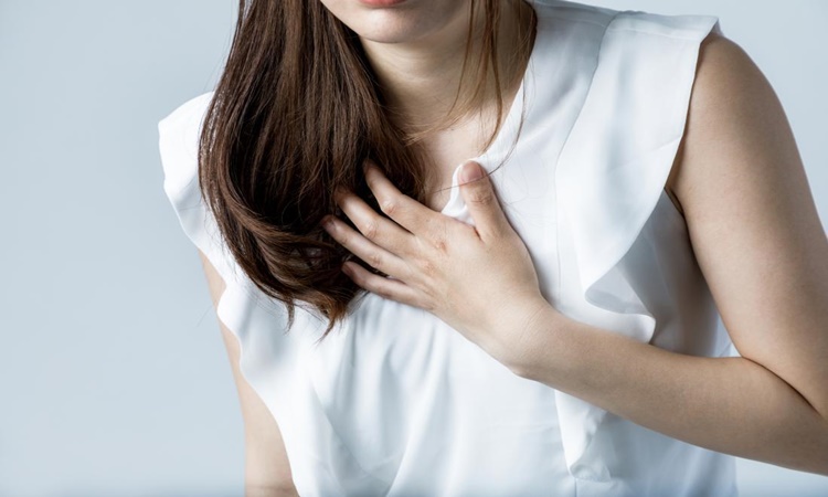 young-woman-holding-her-chest