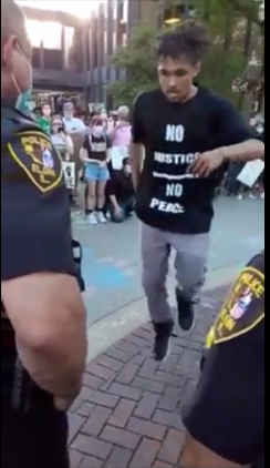 Cop Faces Protester In Breakdance Battle Amid Protests