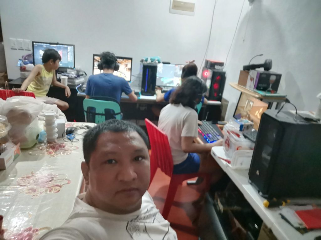 Father Supports Children in Computer
