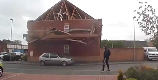 House Suddenly Collapses As Man Goes For Afternoon Stroll (Video)