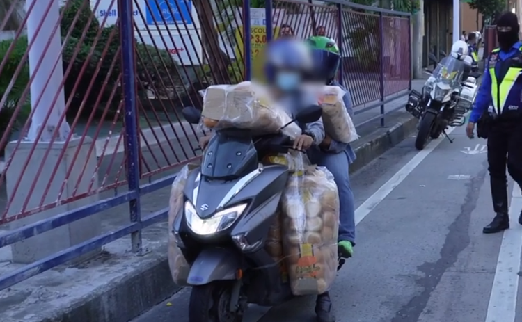 MMDA Apprehends Motorcycle Rider Carrying Bread Products for Overloading