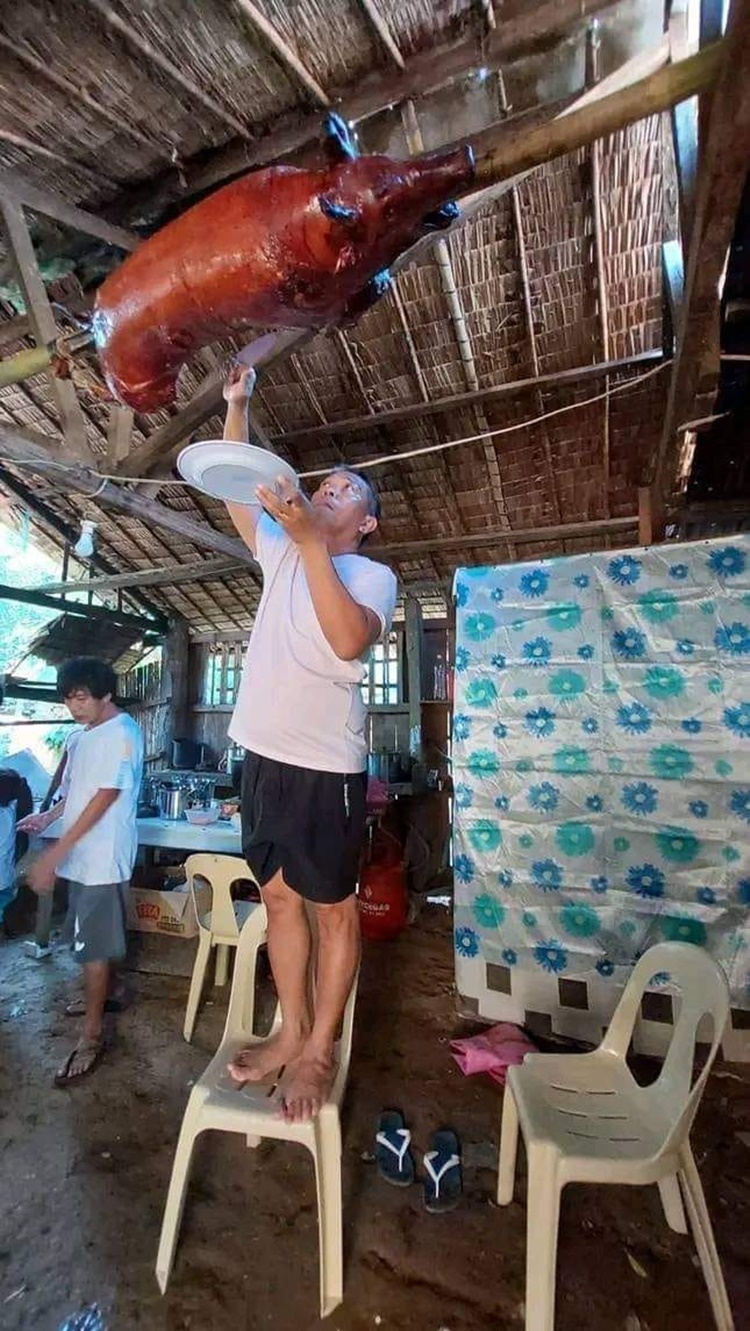 Witty Guy Shares Hilarious Photo Of Lechon Baboy Suspended In The Air