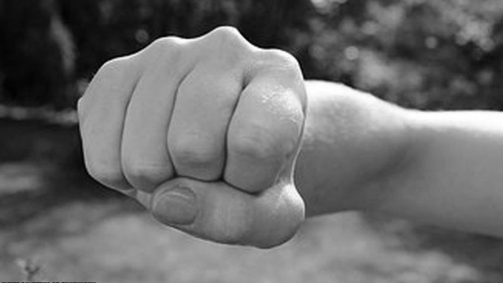 Ex-PCG Member Beating Teacher