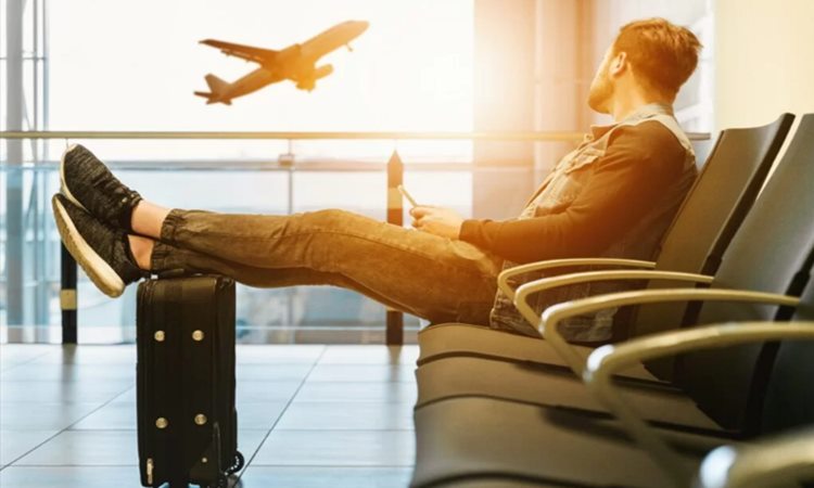 Travel-Insurance-Man-at-airport Travel-Insurance-Man-at-airport